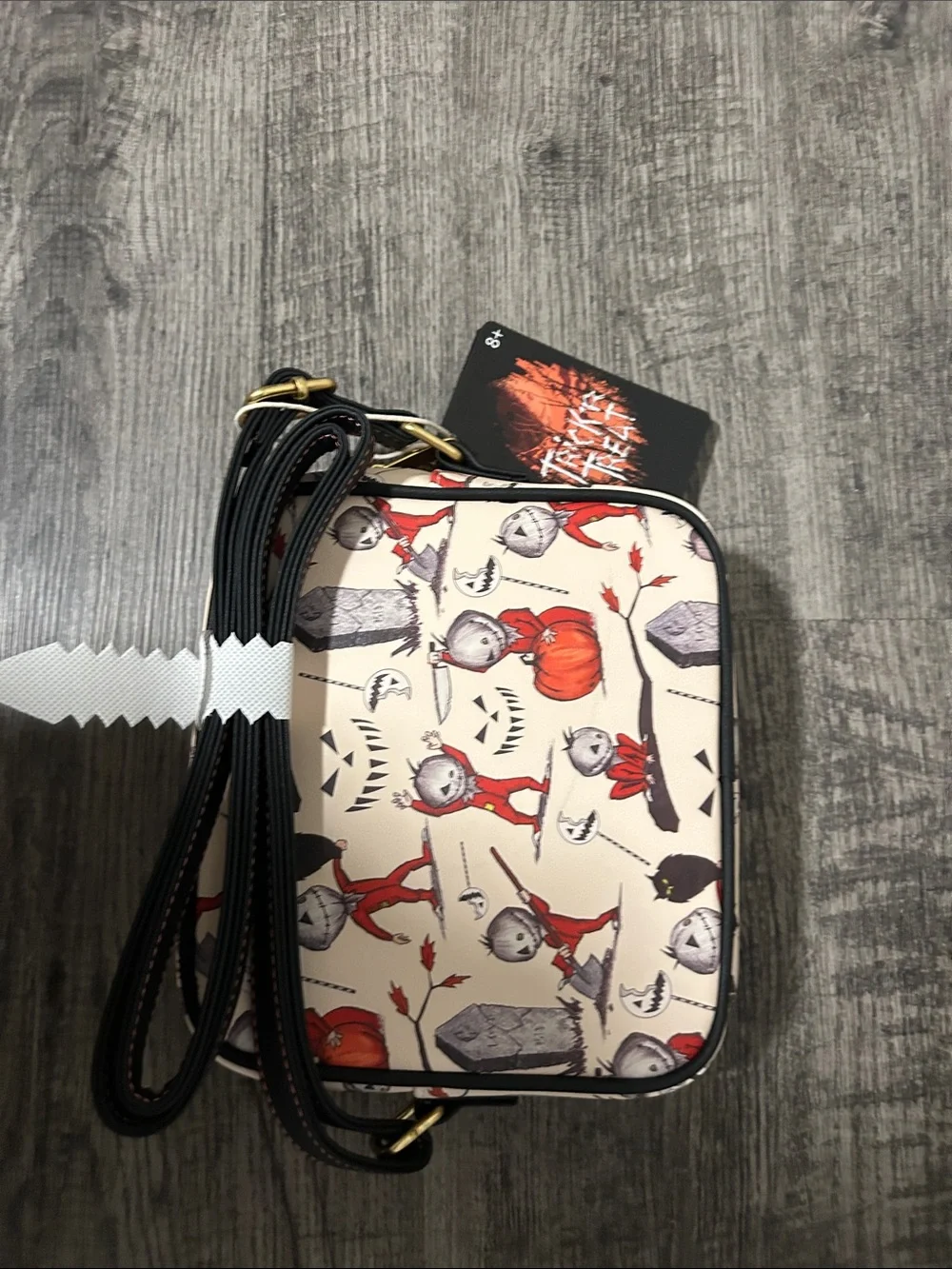 Loungefly Cream Crossbody Bag with Red Halloween Character Print